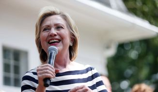 Presidential hopeful Hillary Clinton meets with a group of supporters in the backyard of a Beaverdale, Iowa, home on Saturday, July 25, 2015. (Kelsey Kremer/The Des Moines Register via AP) ** FILE **
