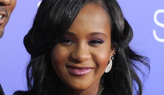 In this Aug. 16, 2012, file photo, Bobbi Kristina Brown attends the Los Angeles premiere of &quot;Sparkle&quot; at Grauman&#39;s Chinese Theatre in Los Angeles. The daughter of the late singer and entertainer Whitney Houston, who was in hospice care after months of receiving medical care, died on Sunday, July 26, 2015. (Photo by Jordan Strauss/Invision/AP, File)
