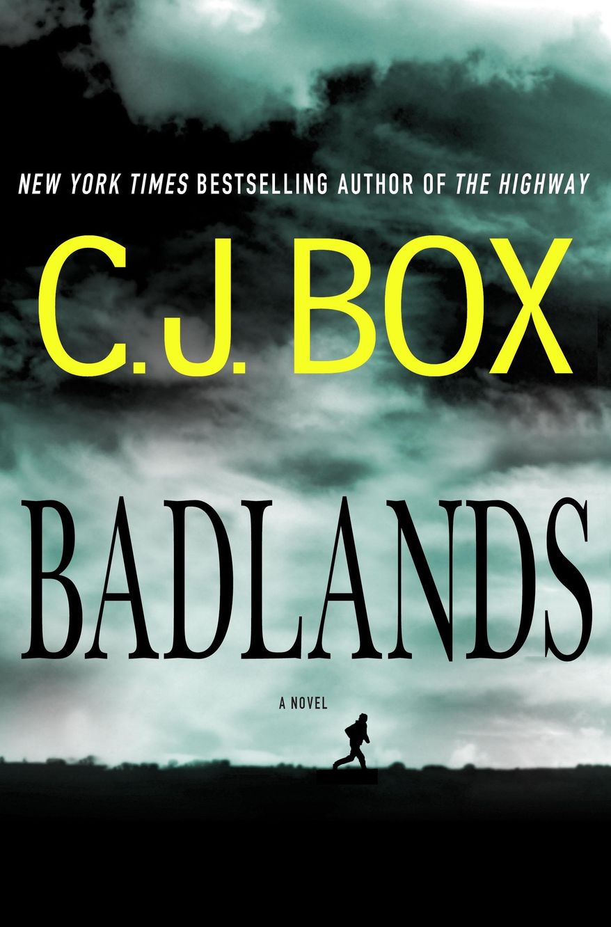 HOLD FOR STORY - This photo provided by courtesy of Minotaur Books shows the cover of the book, "Badlands," by author C.J. Box. The new Wild West, in which a hamlet becomes a boomtown because of its oil-rich fields, makes a sturdy background for C.J. Box’s intriguing fifth stand-alone novel. (Minotaur Books via AP)