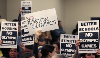 FILE - In this Feb. 5, 2015, file photo, people hold up placards against the Olympic Games coming to Boston, during the first public forum regarding the city&#39;s 2024 Olympic bid, in Boston. Boston&#39;s mayor delivered a harsh blow to the city&#39;s effort to host the 2024 Olympics on Monday, July 27, 2015,  when he declared he wouldn&#39;t sign any document &amp;quot;that puts one dollar of taxpayer money on the line for one penny of overruns on the Olympics.&amp;quot;  That document is the host city contract that most in the Olympics consider crucial to any city&#39;s success.  (AP Photo/Charles Krupa, File)