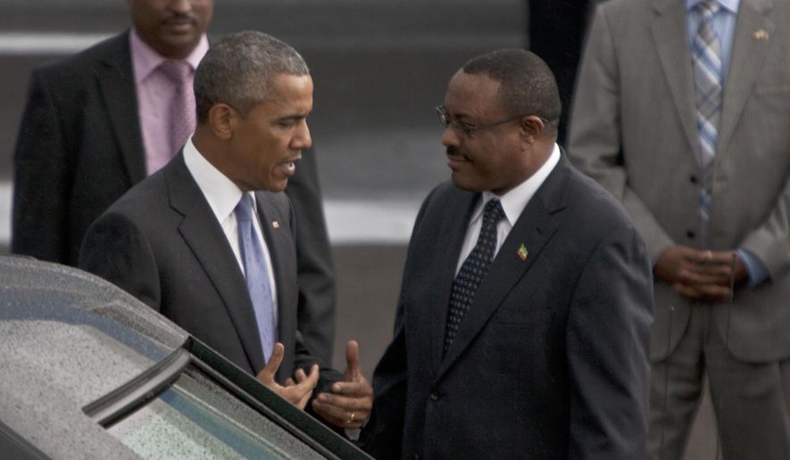 President Barack Obama with Ethiopian Prime Minister Hailemariam Desalegn, right, at Bole International Airport  Addis Ababa, Ethiopia, Sunday, July 26, 2015.  Obama is traveling on a two-nation African tour where he will become the the first sitting U.S. president to visit Kenya and Ethiopia.  (AP Photo/Sayyid Azim)
