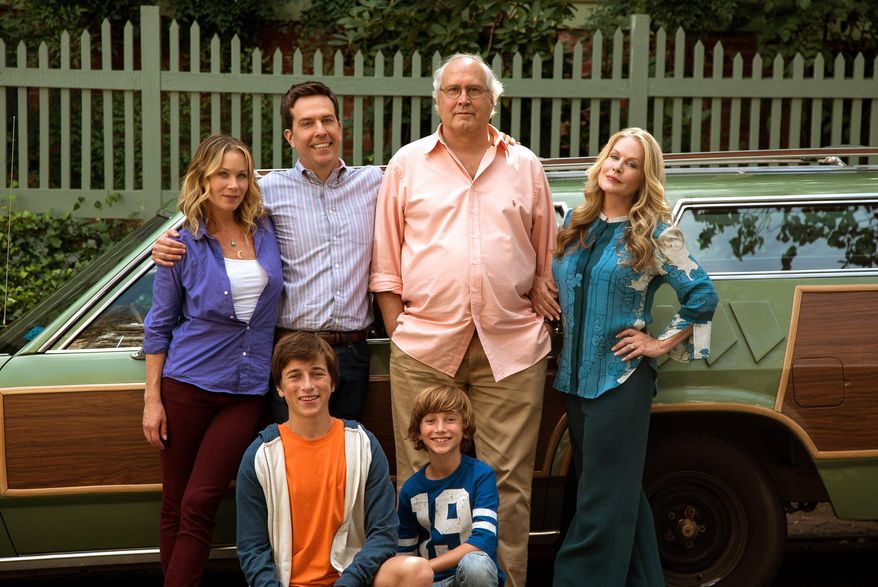 In this image released by Warner Bros. Entertainment, Christina Applegate, standing from left, Ed Helms, Chevy Chase, Beverly D'Angelo, and Skyler Gisondo, kneeling left, and Steele Stebbins appear in a scene from "Vacation." (Hopper Stone/Warner Bros. Entertainment via AP)