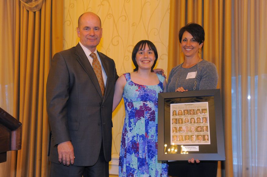 In a Wednesday, May 20, 2015 photo, Nolan Finley, left, Jacqueline Bredenberg, center, of Detroit Country Day, with sponsor Sandy Kuohn pose for a photo,, during the 30th annual Detroit News Outstanding High School Graduate Awards dinner at The Dearborn Inn in Dearborn, Mich. Bredenberg is only the second female to win Gold (hash)1 designation in the 58 years of the Michigan Math Prize Competition for high school students and exceptional middle school students, according to Chris Gardiner, head of the math department at Eastern Michigan University. (Steve Perez/The Detroit News via AP)