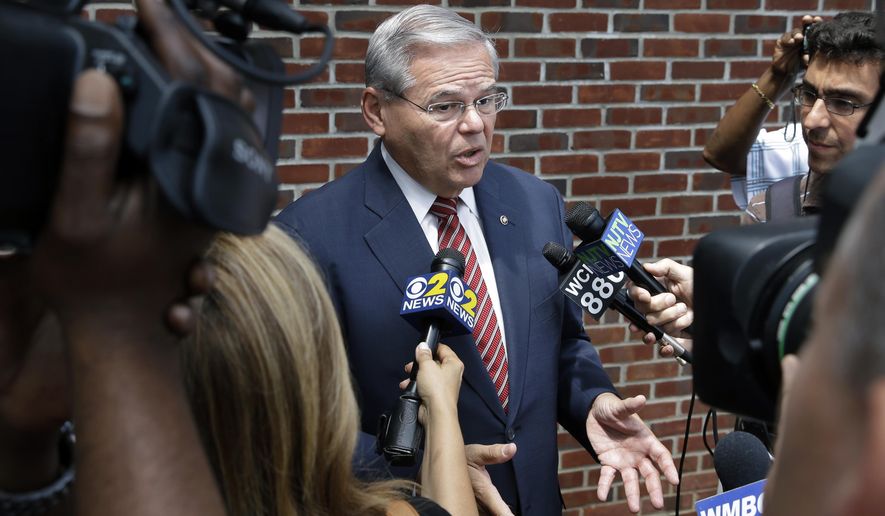 Sen. Robert Menendez, D-N.J., answers a question in Union Township, N.J., Monday, July 27, 2015. The corruption indictment against Menendez is only a few months old, but early court filings pull back the curtain on a legal fight that figures to be bitter, personal and contested at every step. (AP Photo/Mel Evans)