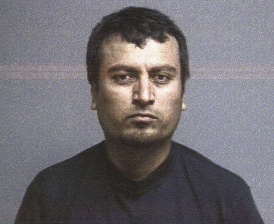 This booking photo released Tuesday, July 28, 2015, by the Lake County Sheriff’s Department shows Juan Emmanuel Razo, 35, arrested after a shootout with deputies in Painesville Township, Ohio. Authorities said Razo is a suspect in the fatal shooting of a woman inside her home, the wounding of a woman walking in a park, and the attempted rape of a 14-year-old girl at that park on Monday. (Lake County Sheriff's Department via AP)