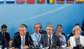 NATO Secretary General Jens Stoltenberg, left, talks during a North Atlantic Council Meeting at NATO headquarters in Brussels on Tuesday July 28, 2015. For just the fifth time in its 66-year history, NATO ambassadors met in emergency session Tuesday to gauge the threat the Islamic State extremist group poses to Turkey, and the debated actions Turkish authorities are taking in response. (AP Photo/Geert Vanden Wijngaert)