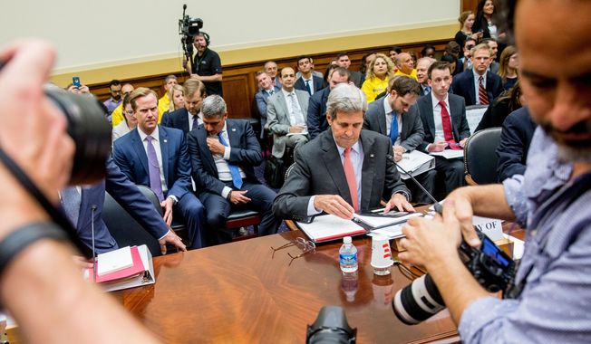 Secretary of State John Kerry prepares to testify on Capitol Hill in Washington, Tuesday, July 28, 2015, before the House Foreign Affairs Committee hearing on the Iran Nuclear Agreement. (AP Photo/Andrew Harnik)