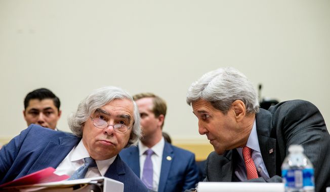 Energy Secretary Ernest Moniz (left) and Secretary of State John Kerry talk on Capitol Hill in Washington on July 28, 2015, prior to testifying before the House Foreign Affairs Committee hearing on the Iran Nuclear Agreement. (Associated Press)