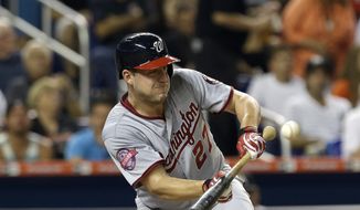Washington Nationals&#39; Jordan Zimmermann bunts a pop out to Miami Marlins pitcher Jose Fernandez in the fifth inning of a baseball game, Tuesday, July 28, 2015, in Miami. (AP Photo/Alan Diaz)
