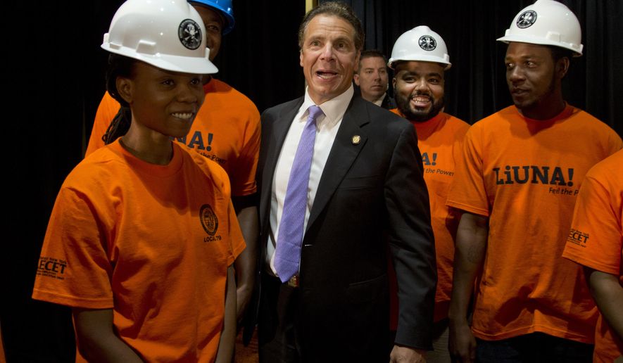 New York Gov. Andrew Cuomo poses for a photo with union members after speaking at the New York State Labors&#x27; meeting on Tuesday, July 28, 2015, in Bolton Landing, N.Y. (AP Photo/Mike Groll)
