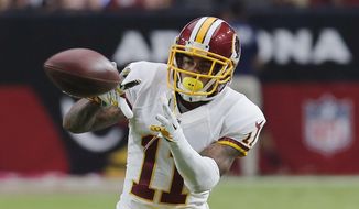 FILE - In this Sunday, Oct. 12, 2014 file photo, Washington Redskins wide receiver DeSean Jackson (11) makes a catch against the Arizona Cardinals during the second half of an NFL football game in Glendale, Ariz. (AP Photo/Rick Scuteri, File)