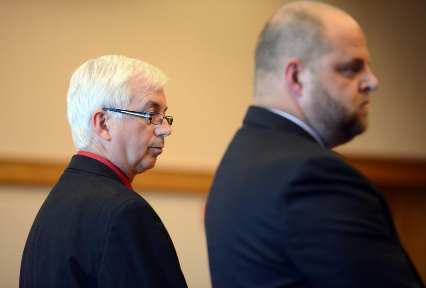 Rep. Steve Kraus, R-Sandusky, left, and his attorney Troy Murphy, right, listen as a jury returns verdicts at the Ottawa County Courthouse, Monday, July 27, 2015, in Port Clinton, Ohio. Kraus, accused of stealing antiques and other items from a home while doing work as an auctioneer, has been convicted on a felony theft charge and immediately removed from office under state law. (Jason Werling/The Sandusky Register via AP)