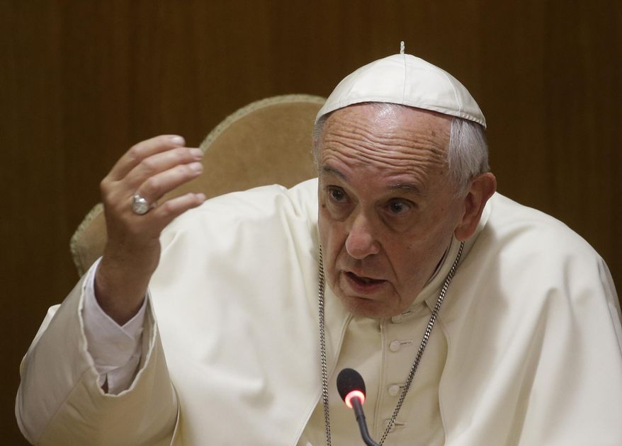 Pope Francis delivers his speech in the Synod Hall during a conference on Modern Slavery and Climate Change at the Vatican on July 21, 2015. (Associated Press/File)