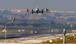 A U.S. Navy plane lands at the Incirlik Air Base near Adana, Turkey, on Wednesday. Turkey agreed to allow the U.S.-led coalition to launch airstrikes against Islamic State from the base but now Egypt is accusing Turkey of working with the Islamic State on the Sinai Peninsula, a bitter feud likely complicate the Obama administration&#39;s regional plans. (Associated Press)
