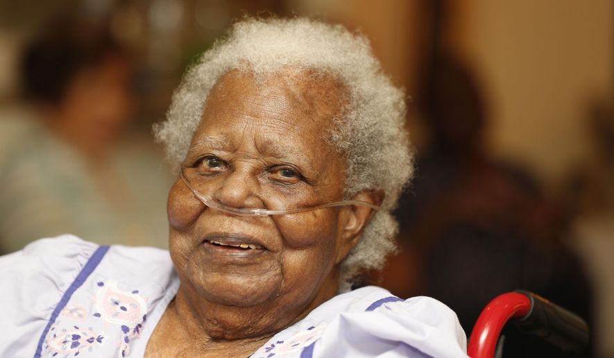 Bernice Williams, poses for a photograph as she celebrates her 103rd birthday on Saturday, July 25, 2015 in Dallas. She is known locally as Ms. Boots. She got her nickname 103 years ago, when she was a baby. Her mother brought her along as she did housework for a rich white family. She'd leave her in an apple crate for the family's children to watch over. They started calling her Boots, and it stuck. (Michael Ainsworth/The Dallas Morning News via AP) MANDATORY CREDIT; MAGS OUT; TV OUT; INTERNET USE BY AP MEMBERS ONLY; NO SALES