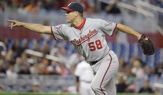 Washington Nationals closing pitcher Jonathan Papelbon reacts when Michael Morse strikes out for the final out in the ninth inning of a baseball game, Thursday, July 30, 2015, in Miami. The Nationals defeated the Marlins 1-0. (AP Photo/Lynne Sladky)