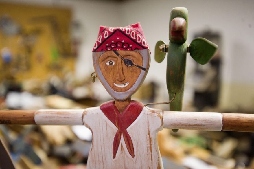 ADVANCE FOR USE SUNDAY, AUG. 2 AND THEREAFTER - In this June 10, 2015, 2015 photo, a detail of a whirligig from the series of "Sailor Jack” whirligigs created Gary Foster is seen in Charleston, Ill. Foster started making whirligigs about 30 years ago. (Kevin Kilhoffer/Times-Courier via AP)