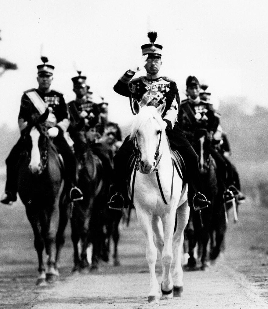 FILE - In this 1937 file photo, Japan&#39;s Emperor Hirohito salutes from his mount, his favorite white horse, during a military review in Tokyo. The original recording of Japan&#39;s Emperor Hirohito&#39;s war-ending speech has come back to life in digital form. The original sound was released Saturday, Aug. 1, 2015 by the Imperial Household Agency in digital format, ahead of the 70th anniversary of the speech and the war&#39;s end. (AP Photo/File)