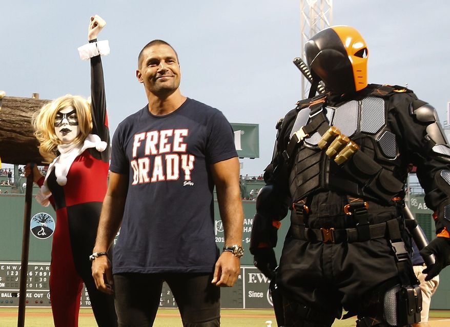 Characters in costume from Boston Comic Con stand on the field before a baseball game between the Boston Red Sox and the Chicago White Sox Boston, Thursday, July 30, 2015. (AP Photo/Michael Dwyer)