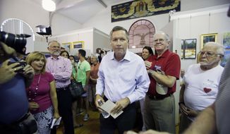 Republican presidential candidate, Ohio Gov. John Kasich arrives for a town hall meeting at the Historical Society of Cheshire County, Friday, July 31, 2015, in Keene, N.H. (AP Photo/Jim Cole)