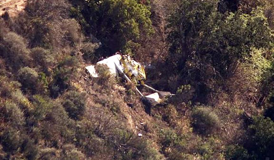 This image made from a video provided by KABC-TV/abc7.com shows the wreckage of a small plane that was found crashed in the Ventura County mountains near Santa Paula, Calif., Saturday, Aug. 1, 2015. A passer-by found the wreckage of the plane on Saturday about four miles southeast of the Santa Paula airport. The pilot was found dead in the wreckage. (KABC-TV/abc7.com via AP) MANDATORY CREDIT