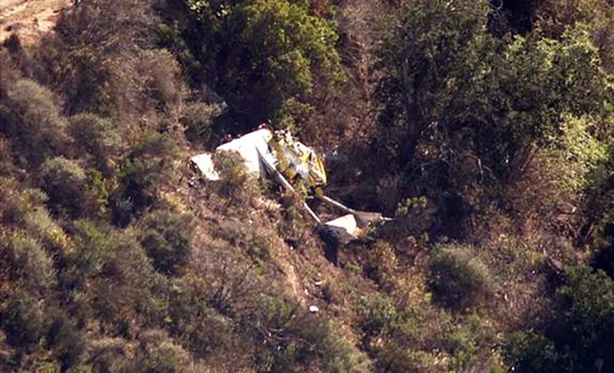 This image made from a video provided by KABC-TV/abc7.com shows the wreckage of a small plane that was found crashed in the Ventura County mountains near Santa Paula, Calif., Saturday, Aug. 1, 2015. A passer-by found the wreckage of the plane on Saturday about four miles southeast of the Santa Paula airport. The pilot was found dead in the wreckage. (KABC-TV/abc7.com via AP) MANDATORY CREDIT