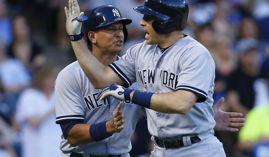 New York Yankees designated hitter Alex Rodriguez, left, celebrates with teammate Mark Teixeira after Teixeira&#39;s grand slam during the second inning of a baseball game against the Chicago White Sox in Chicago, Friday, July 31, 2015. (AP Photo/Jeff Haynes)
