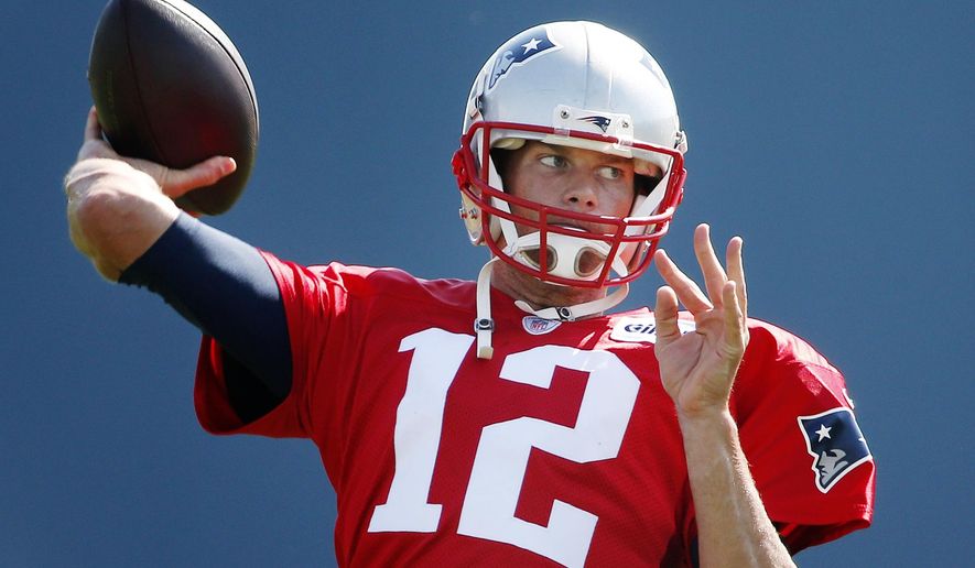 New England Patriots quarterback Tom Brady passes during an NFL football training camp in Foxborough, Mass., Saturday, Aug. 1, 2015. (AP Photo/Michael Dwyer)