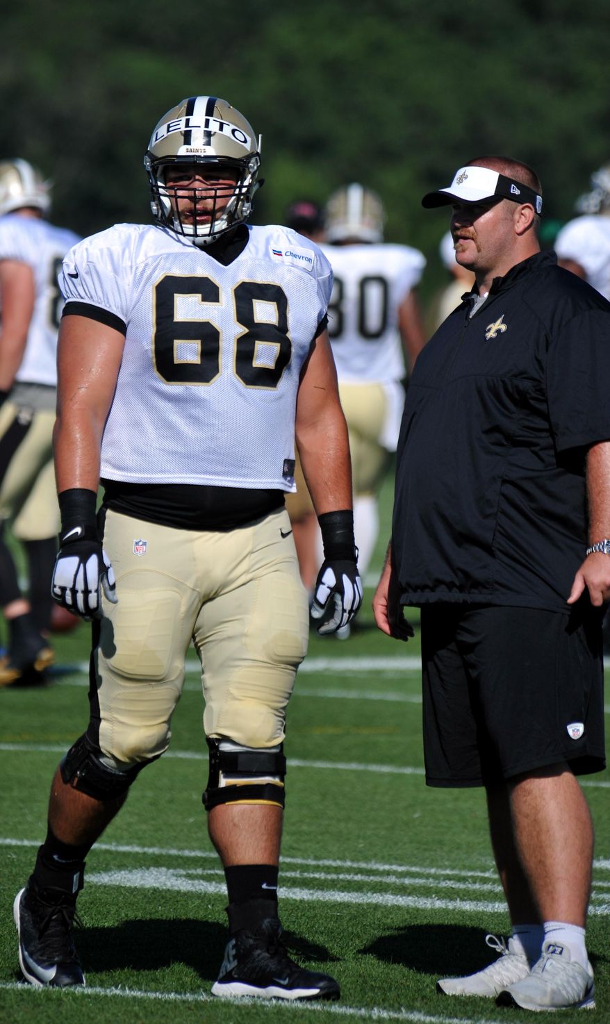 New Orleans Saints center Tim Lelito (68) talks with staff during a drill at  the team&#39;s NFL football training camp in White Sulphur Springs, W. Va., Saturday, Aug. 1, 2015. (AP Photo/Chris Tilley)