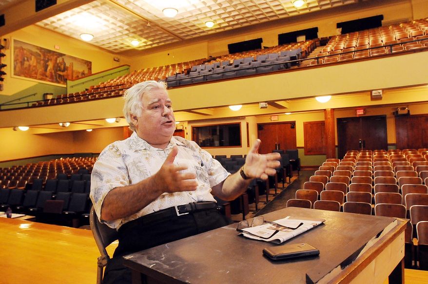 In this Monday, July 10, 2015 photo, Paul Warshauer, executive director of State Street Theater, discusses plans for the old middle school auditorium in New Ulm, Minn. The State Street Theater group plans to upgrade the facility and use it to put on plays and musicals. (John Cross/The Free Press via AP) MANDATORY CREDIT