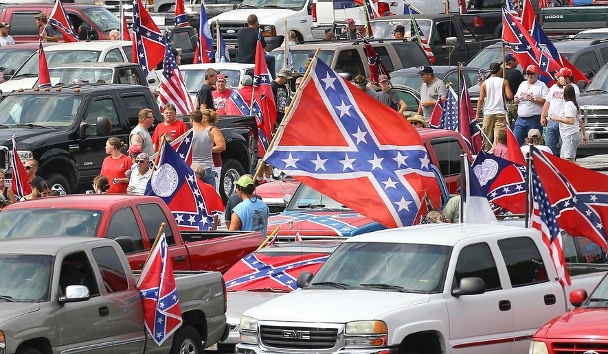 Pro-Confederate flag supporters gather for a rally at Stone Mountain Park on Saturday, Aug. 1, 2015, in Stone Mountain, Ga.  (Curtis Compton/Atlanta Journal-Constitution via AP)  MARIETTA DAILY OUT; GWINNETT DAILY POST OUT; LOCAL TELEVISION OUT; WXIA-TV OUT; WGCL-TV OUT; MANDATORY CREDIT