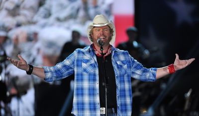 FILE - In this April 7, 2014 file photo shows Toby Keith performs at ACM Presents an All-Star Salute to the Troops  in Las Vegas. The New York location of country music star Toby Keith&#39;s chain of restaurants owes more than a quarter-million dollars in sales taxes to the state. A tax warrant filed by the state earlier this month seeks $107,000 owed by  Keith&#39;s I Love this Bar &amp; Grill at the Destiny USA shopping mall in Syracuse. Keith&#39;s Syracuse bar, which opened last year, also owes more than $145,000 in sales taxes from earlier in 2013. The musician&#39;s chain of restaurants, named for the title of one of his hit songs, features guitar-shaped bars, beer in mason jars and traditional southern food. (Photo by Chris Pizzello/Invision/AP)
