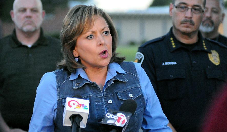 Gov. Susana Martinez speaks to reporters about the two explosive devices that were detonated on Sunday morning at Holy Cross Catholic Church and Calvary Baptist Church, Sunday, Aug. 2, 2015. (Robin Zielinski/Las Cruces Sun-News via AP)