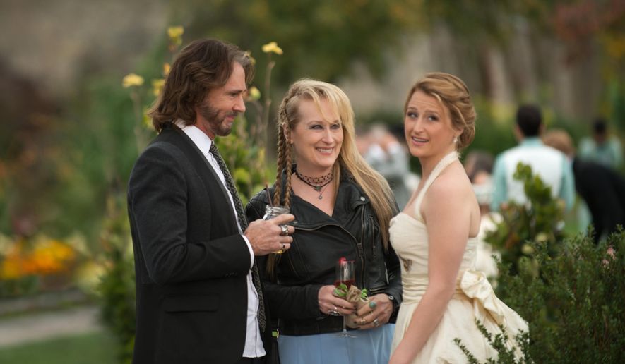 This photo provided by courtesy of Sony Pictures shows, Rick Springfield, from left, as Greg, Meryl Streep, as Ricki, and Mamie Gummer as Julie, in TriStar Pictures' "Ricki and the Flash." The movie opens in U.S. theaters on Aug. 7, 2015 and co-stars Ms. Streep's real-life daughter, Mamie. (Bob Vergara/Sony Pictures via AP)