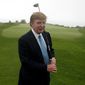 In this Nov. 9, 2002, file photo, Donald Trump holds a driver on the 11th green of his Ocean Trails Golf Club in Rancho Palos Verdes. (AP Photo/Damian Dovarganes, File) ** FILE **
