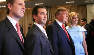 In this April 9, 2010m file photo, Donald Trump, chairman and CEO of the Trump Organization, poses with his children Eric, left, Donald Jr., second left, and Ivanka, at the opening of the Trump SoHo New York. (AP Photo/Mark Lennihan, File)