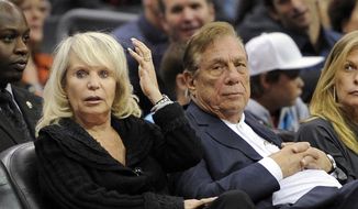 FILE - In this Nov. 12, 2010, file photo, Shelly Sterling, left, sits with her husband, Los Angeles Clippers owner Donald Sterling, during the Clippers&#x27; NBA basketball game against the Detroit Pistons in Los Angeles. The former team owner has filed for divorce from Shelly Sterling, his attorney Bobby Samini said Wednesday, Aug. 5, 2015. (AP Photo/Mark J. Terrill, File)
