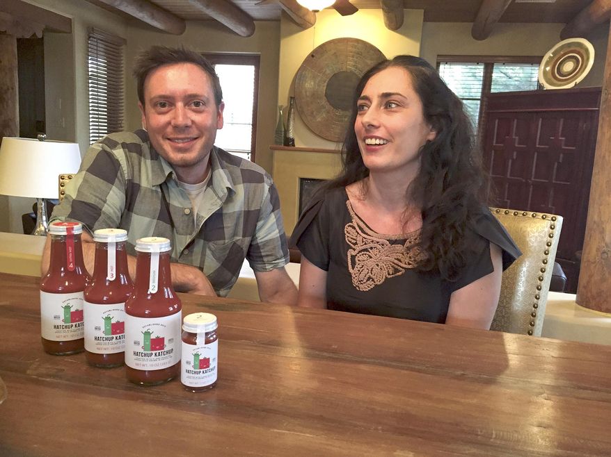 Jacob Seidenberg Korn and Carmit Levin talk about Hatchup Katchup on July 14, 2015 in Santa Fe, N.M. Levin and Seidenberg Korn, both 35, are now preparing to open a Santa Fe commercial kitchen in August to ramp up production of Hatchup Katchup. They’re eager to set up shop closer to home. (Justin Horwath/Santa Fe New Mexican via AP) MANDATORY CREDIT