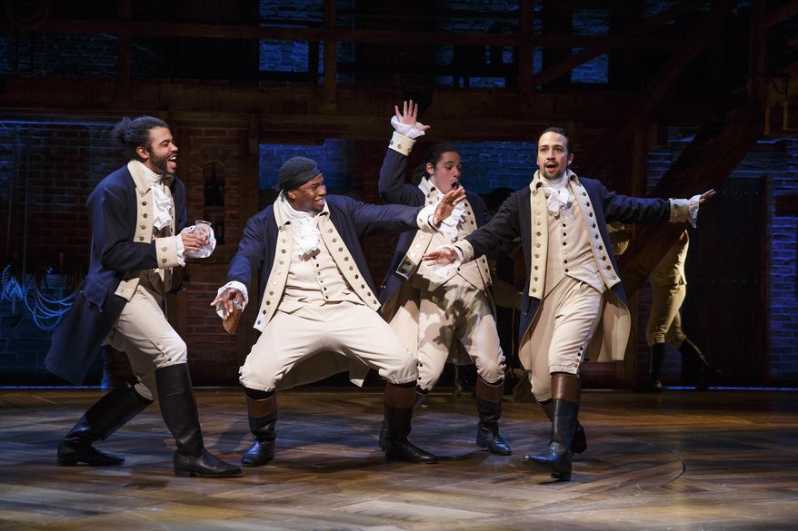In this image released by Sam Rudy Media Relations, Daveed Diggs, from left, Okieriete Onaodowan, Anthony Ramos and Lin-Manuel Miranda appear during a performance of the musical "Hamilton," at the Richard Rodgers Theatre in New York. (Joan Marcus/Sam Rudy Media Relations via AP)