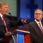 Republican presidential candidate Donald Trump, left, speaks as Jeb Bush listens during the first Republican presidential debate at the Quicken Loans Arena Thursday, Aug. 6, 2015, in Cleveland. (AP Photo/Andrew Harnik) ** FILE **