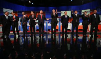 Republican presidential candidates from left, Chris Christie, Marco Rubio, Ben Carson, Scott Walker, Donald Trump, Jeb Bush, Mike Huckabee, Ted Cruz, Rand Paul, and John Kasich take the stage for the first Republican presidential debate at the Quicken Loans Arena Thursday, Aug. 6, 2015, in Cleveland. (Associated Press)