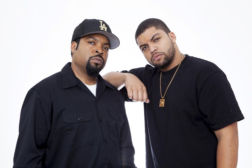 In this Sunday, August 2, 2015 photo, Ice Cube left, and son O'Shea Jackson Jr. pose for a portrait in promotion of the new film "Straight Outta Compton," at the Four Seasons Hotel in Los Angeles. The 23-year-old makes his acting debut playing his father in the movie opening Aug. 14. Father and son sat side by side to talk with The Associated Press about bringing Ice Cube to life on screen. (Photo by Rebecca Cabage/Invision/AP)