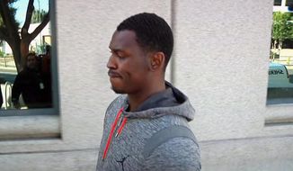 In this image made from video and provided by KNTV, San Francisco 49ers Aldon Smith walks past cameras after being released from the Santa Clara County Jail on Friday, Aug. 7, 2015 in San Jose, Calif.  Santa Clara Police arrested Smith on charges of hit and run, drunken driving and vandalism. (Michael Horn/KNTV via AP)