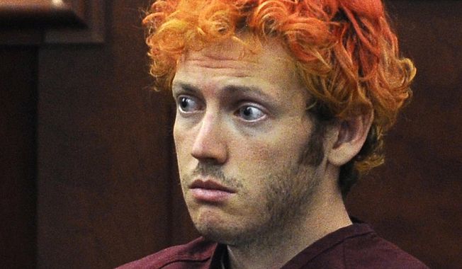 In this July 23, 2012, file photo, James Holmes, who was charged with killing 12 moviegoers and wounding 70 more in a shooting spree in a crowded theatre in 2012, sits in Arapahoe County District Court in Centennial, Colo. (RJ Sangosti/The Denver Post via AP, Pool, File)