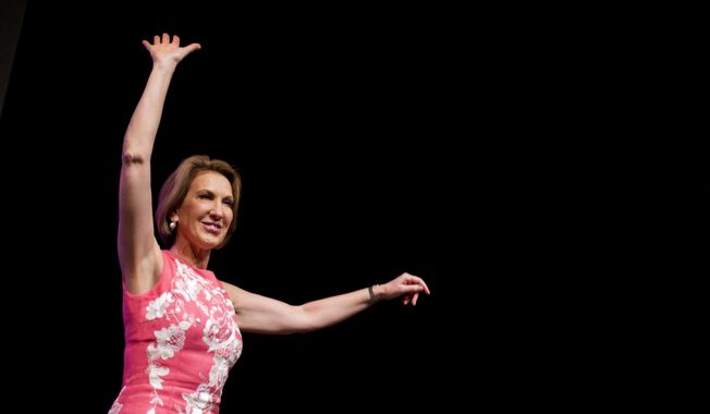 Republican presidential candidate Carly Fiorina waves to the crowd after speaking at the RedState Gathering, Friday, Aug. 7, 2015, in Atlanta. (AP Photo/David Goldman)