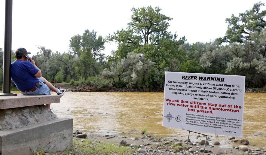 A warning sign from the city is displayed in front of the Animas River as orange sludge from a mine spill upstream flows past Berg Park in Farmington, N.M., on Aug. 8, 2015. About 1 million gallons of wastewater from Colorado&#39;s Gold King Mine began spilling into the Animas River on Wednesday when a cleanup crew supervised by the Environmental Protection Agency accidentally breached a debris dam that had formed inside the mine. The mine has been inactive since 1923. (Alexa Rogals/The Daily Times via AP) **FILE**
