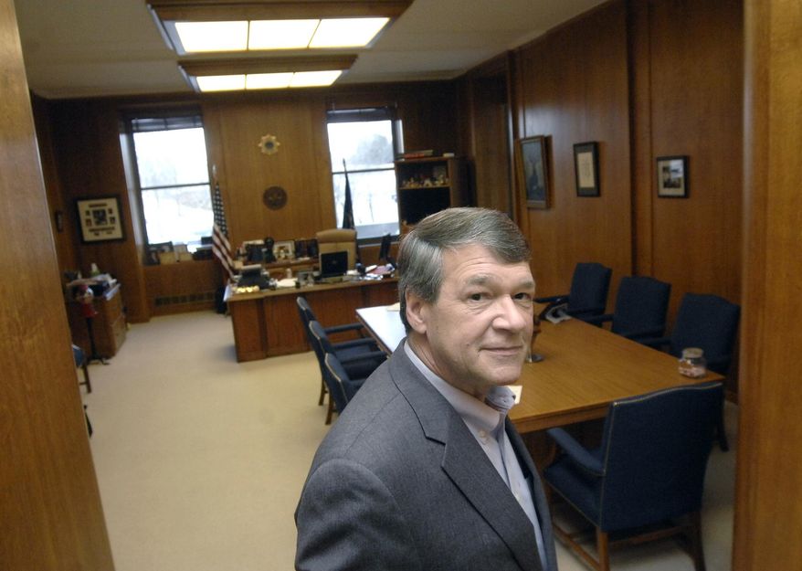 FILE - In this Feb. 28, 2014 file photo, Attorney General Wayne Stenehjem is photographed in Bismarck, N.D. Almost 40,000 North Dakotans are allowed to carry a hidden firearm nearly anywhere they want to go in the state nowadays. It's a pistol-packing population that has more than doubled in the past three years and is due to in part "to major crimes getting headlines" and a dramatic rise in concealed-carry instructors running businesses pitching guns for self-defense, Stenehjem said. (AP Photo/The Bismarck Tribune, Mike McCleary)