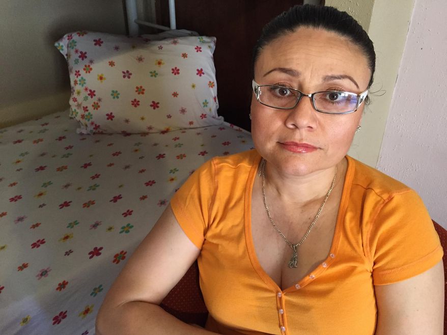 In this Thursday, July 30, 2015 photo, Rosa Robles Loreto sits in her small room at Southside Presbyterian Church in Tucson, Ariz., where she has taken sanctuary from deportation for a year. Robles Loreto, 42, says she is not leaving the church until the government assures her she will not be deported. (AP Photo/Astrid Galvan,File)