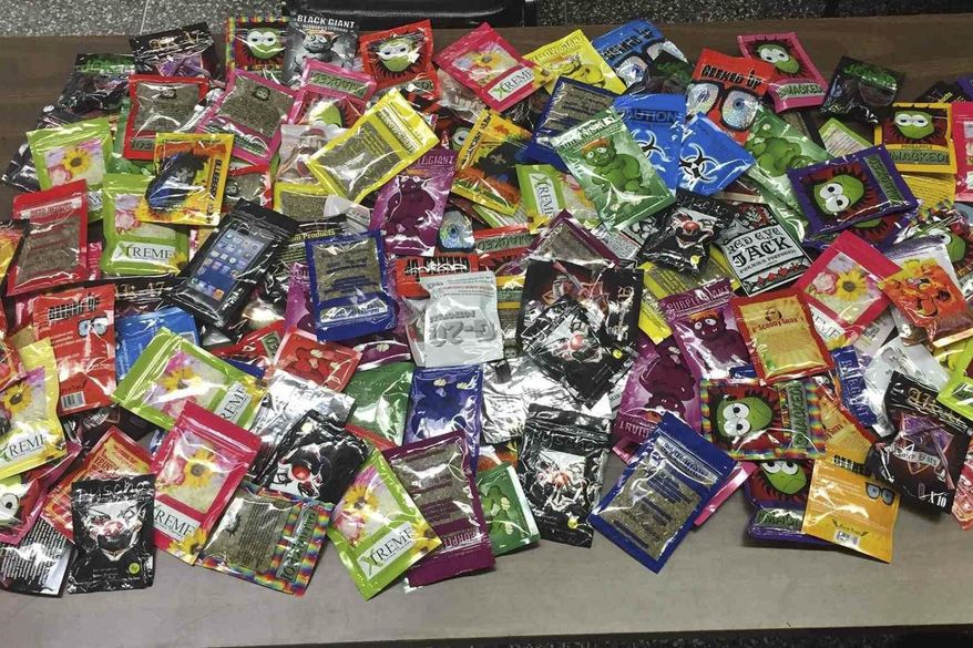 This photo provided Friday, Aug. 7, 2015 by New York Police Department shows packets of synthetic marijuana seized after a search warrant was served at a newsstand in Brooklyn, N.Y. (AP Photo/New York Police Department)
