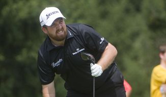 Shane Lowry, of Ireland, watches his tee shot on the fourth hole, during the final round of the Bridgestone Invitational golf tournament, in Akron, Ohio, Sunday, Aug. 9, 2015.  (AP Photo/Phil Long)